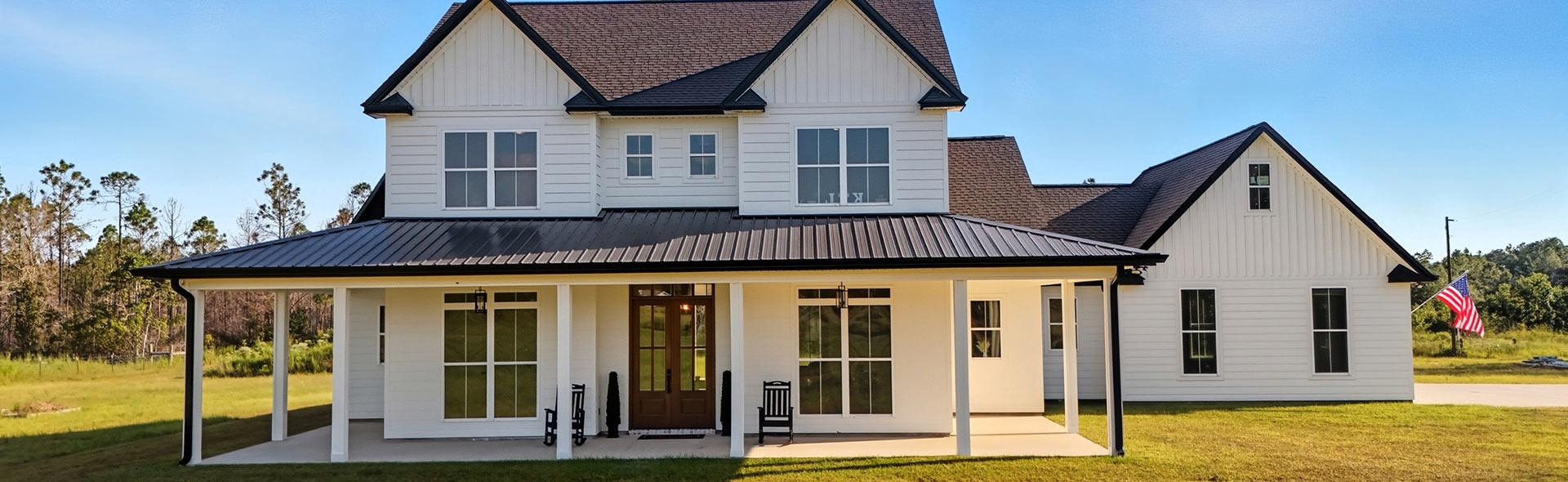 White farmhouse custom home from design build services in Waveland MS