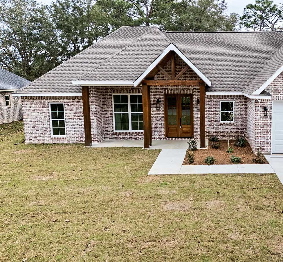 Brick home exterior with timber entry from home additions in Gulfport MS