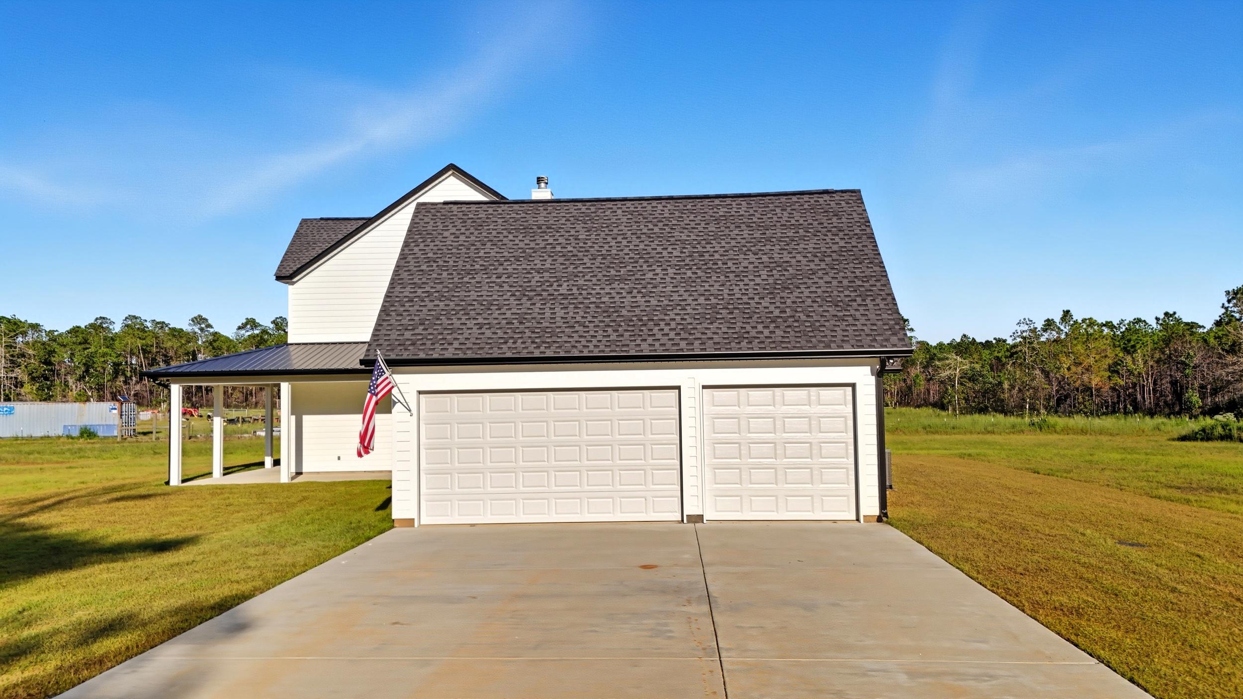 An exterior garage that was built as part of home additions made to a modern farmhouse in Pass Christian, MS