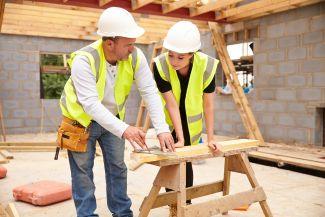 Two contractors working on a custom home build in Kiln, MS